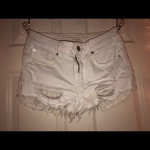 white ripped american eagle shorts
